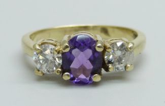 An 18ct gold, amethyst and diamond ring, approximately 0.90ct diamond weight, 3.9g, Q