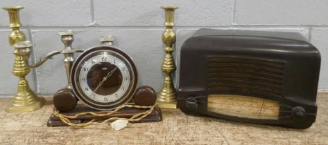 A Cossor Bakelite radio, a Metamec Art Deco clock, a pair of brass candlesticks and a candelabra