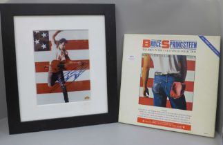 A framed autographed Bruce Springsteen photograph and a boxed set of 12" singles