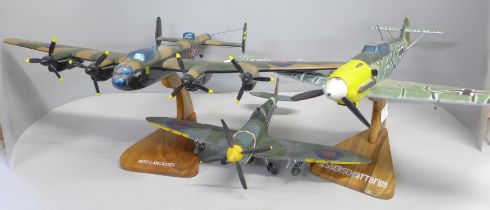 Three WWII model aircraft on stands, Avro Lancaster, Spitfire and Messerschmitt BF109