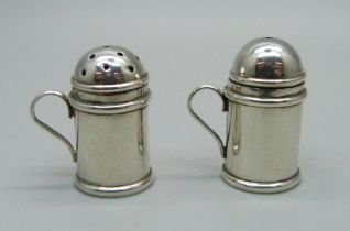 A miniature silver salt and pepper pair