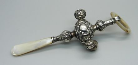 A vintage silver and mother of pearl rattle