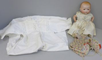 An Armand Marseille doll, a/f and vintage gowns and clothing