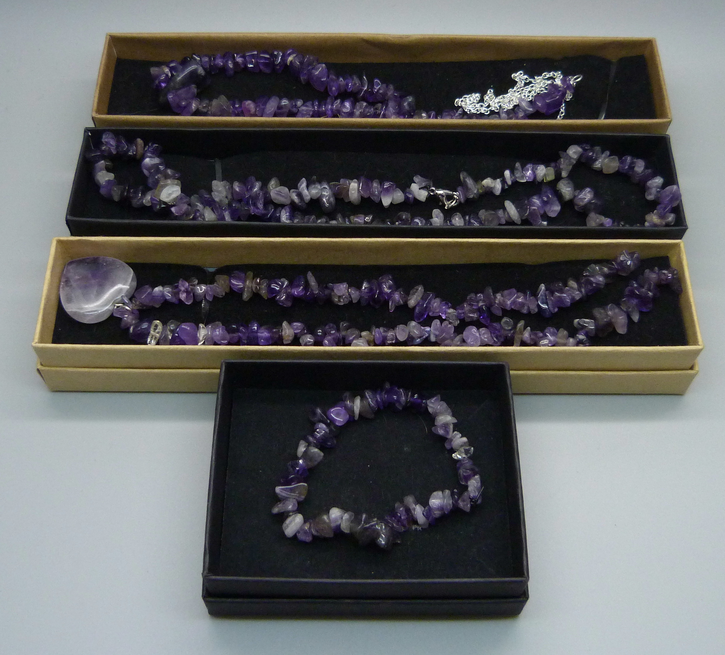 Three amethyst necklaces and a bracelet