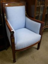 A 19th Century French Empire style mahogany, parcel gilt and blue fabric upholstered armchair