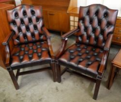 A pair of mahogany and red oxblood leather Gainsborough style armchairs