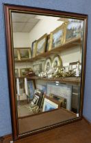A rectangular framed mirror