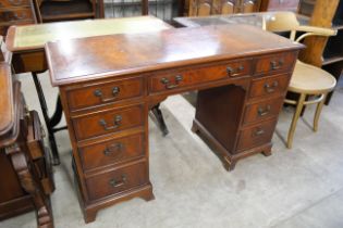 A George III style inlaid mahogany desk