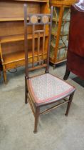 An Arts and Crafts inlaid mahogany side chair
