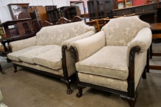 An Edward VII carved mahogany and fabric upholstered settee and armchair