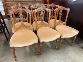 A set of six Victorian inlaid walnut dining chairs