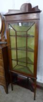 An Edward VII inlaid mahogany corner cabinet