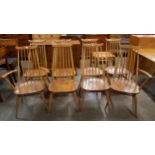 A set of eight Ercol Blonde elm and beech Goldsmith chairs