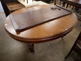 A Victorian walnut extending dining table