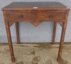 An Art Deco oak two drawer side table