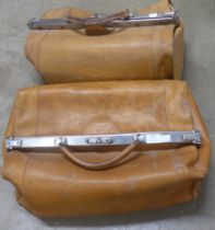 Two tan leather Gladstone bags