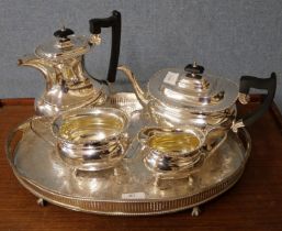 A silver plated four piece tea and coffee service and a tray