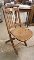 An early 20th Century beech folding chair