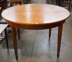 A Jentique 513 model teak circular extending dining table
