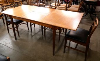 A McIntosh T2 model teak extending dining table and four chairs