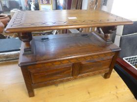 A miniature carved hardwood monk's bench