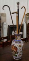 A Chinese vase and assorted walking sticks