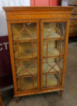 An Edward VII Sheraton Revival satinwood two door bookcase