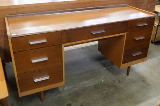 A Stag Concord oak desk, designed by John & Sylvia Reid