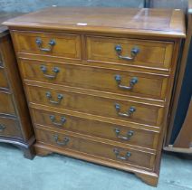 A George III style inlaid yew wood chest of drawers