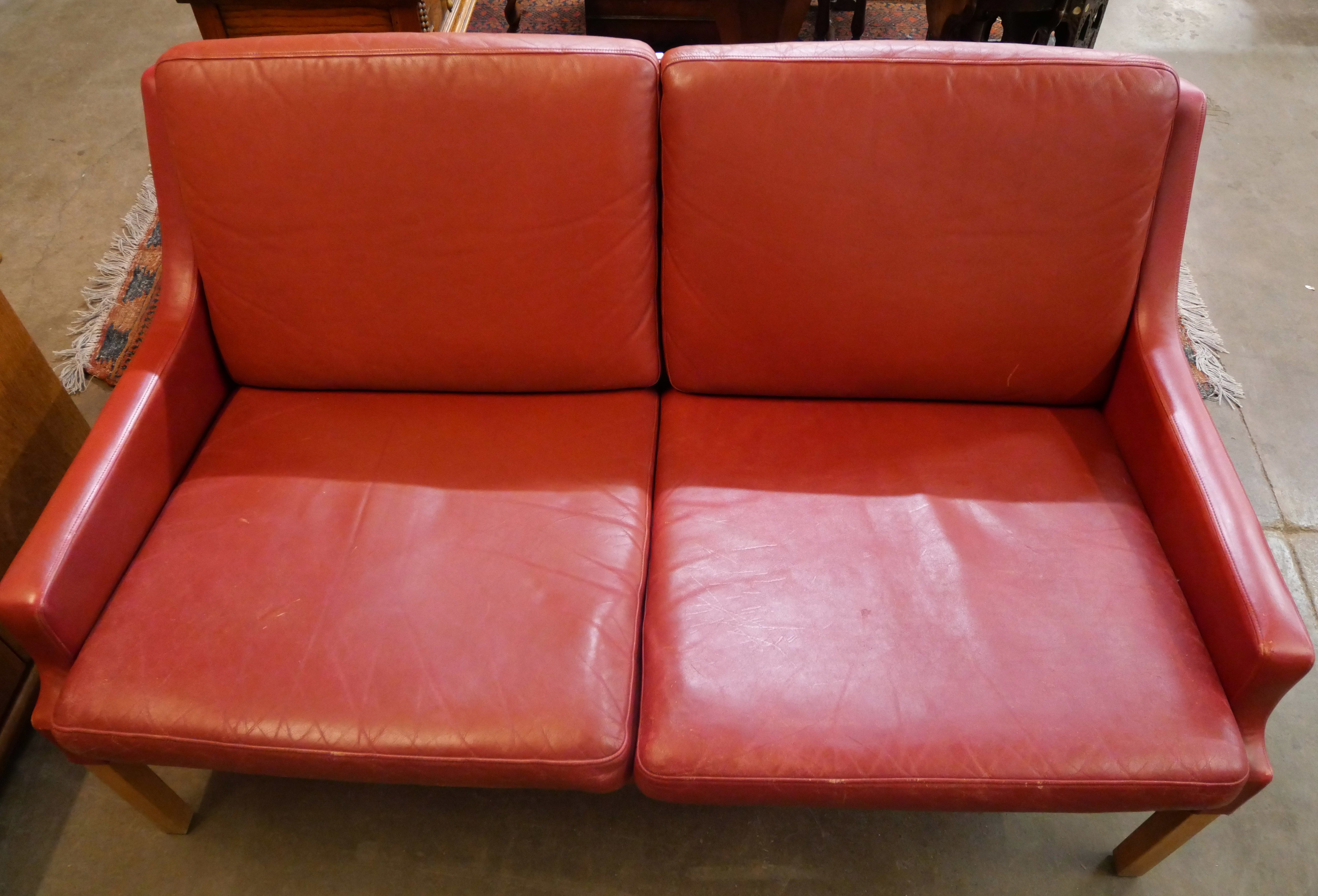 A Danish Thams crimson leather two seater sofa, designed by Rud Thygesen - Image 2 of 2