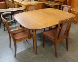 A G-Plan Sierra teak extending dining table and four Fresco dining chairs