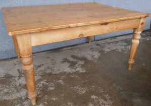 A large pine farmhouse kitchen table