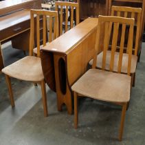 A Jentique 507 model teak drop leaf table and four chairs