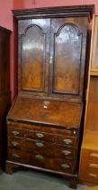 A George I walnut bureau bookcase