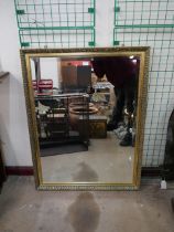 A large gilt framed mirror