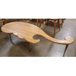 A teak asymmetrical coffee table