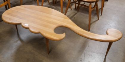 A teak asymmetrical coffee table