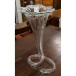 A large glass floral shaped vase