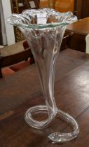 A large glass floral shaped vase