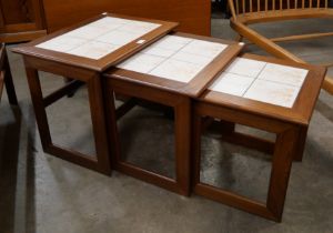 A Danish teak and tiled top nest of tables