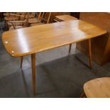 An Ercol Blonde elm and beech plank top dining table