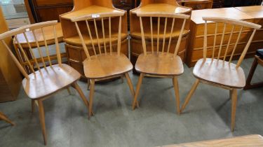 A set of four Ercol Blonde elm and beech chairs