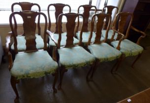 A set of eight Queen Anne style walnut dining chairs