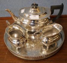A silver plated three piece tea service and a tray