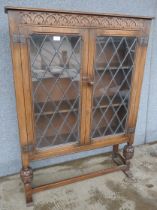 A carved oak two door bookcase