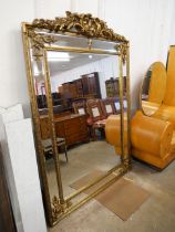 A large French Louis XIV style gilt framed mirror