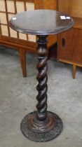 A late Victorian carved oak telescopic barleytwist torchere