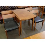 A teak drop leaf dining table and four chairs