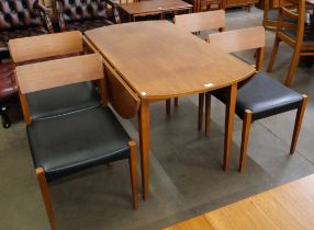 A teak drop leaf dining table and four chairs
