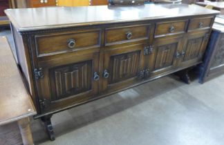 A carved oak linenfold dresser